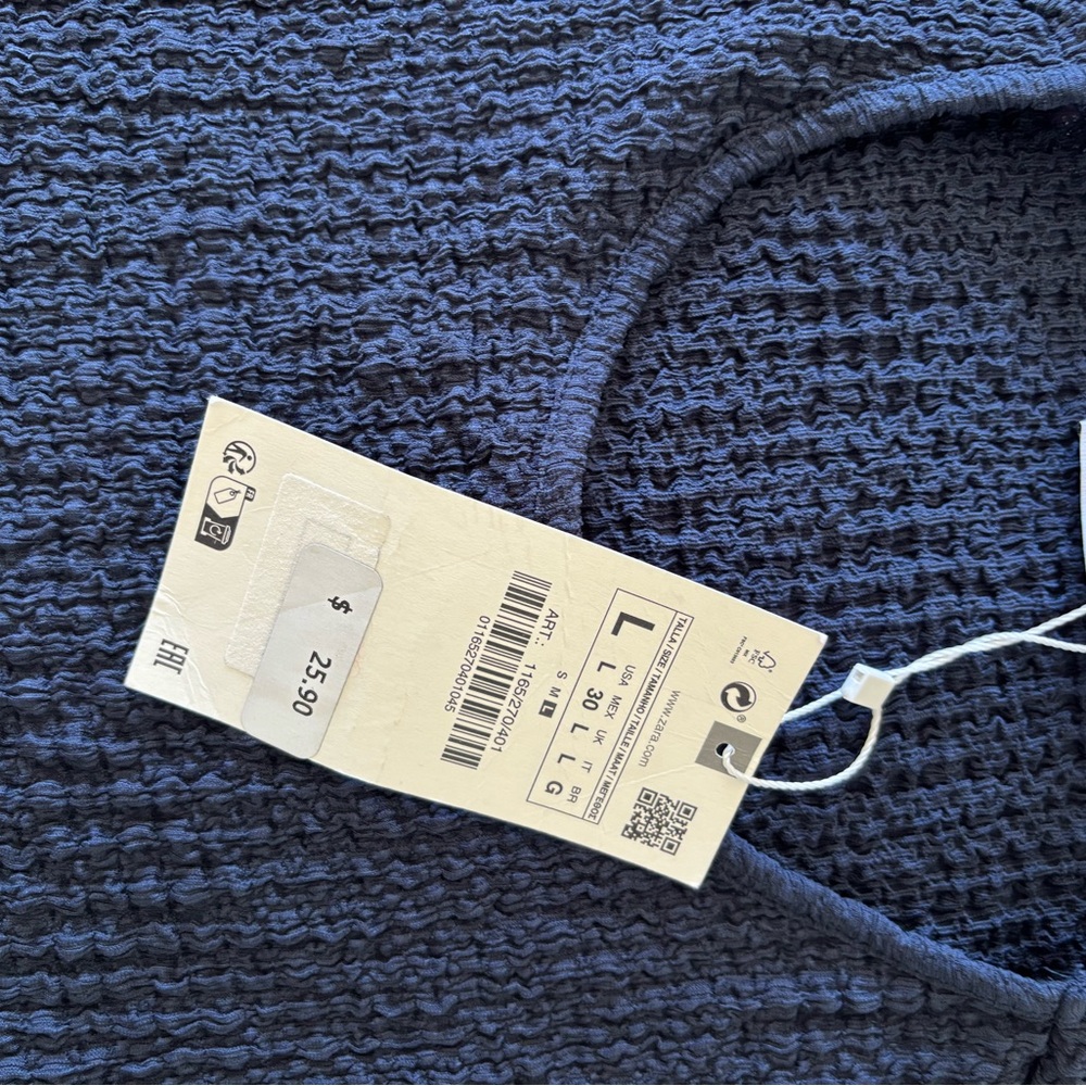 New, never worn.  Stretchy easy top